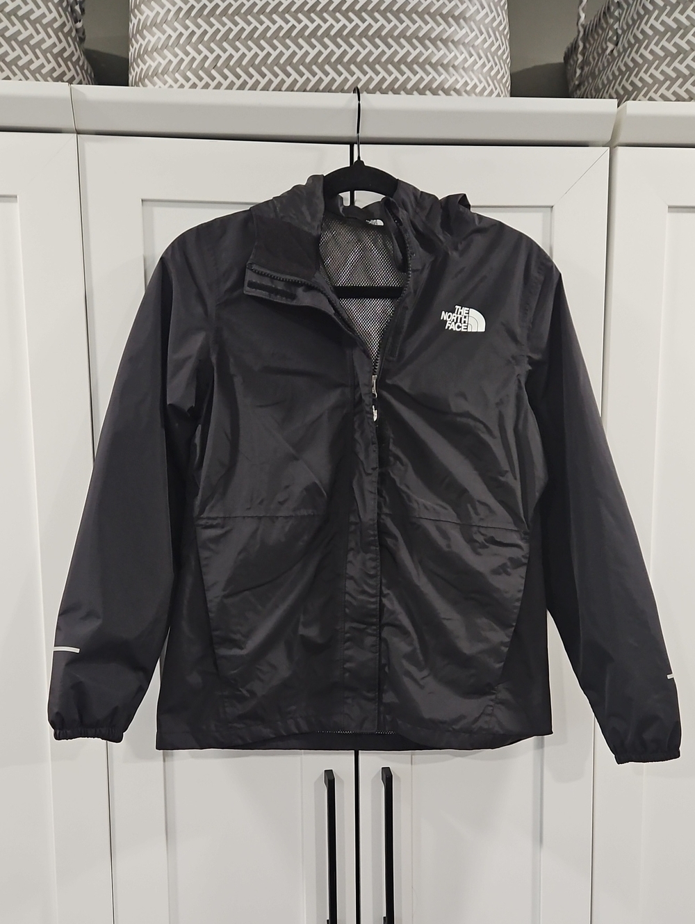 The North Face Girls Black Hooded Windbreaker with White Logo.  Size 14/16.